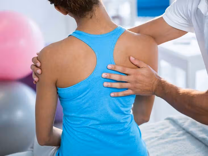 Chiropractor performing a spinal adjustment on a patient at Abundant Life Chiropractic in Chanhassen MN