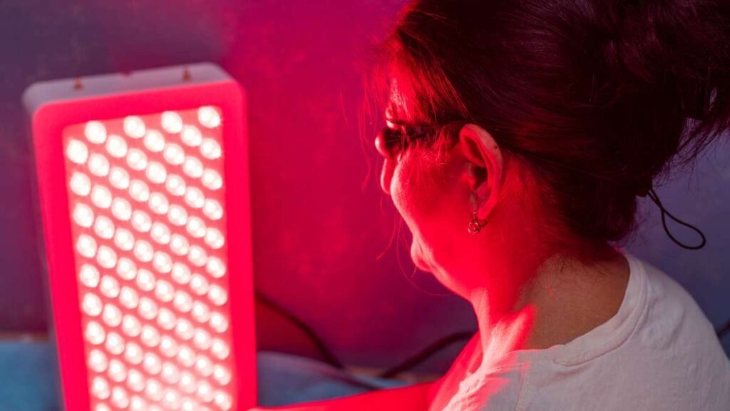 Patient receiving red light therapy at Abundant Life Chiropractic to support healing and recovery