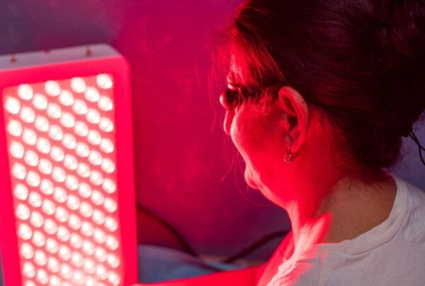Patient receiving red light therapy at Abundant Life Chiropractic to support healing and recovery